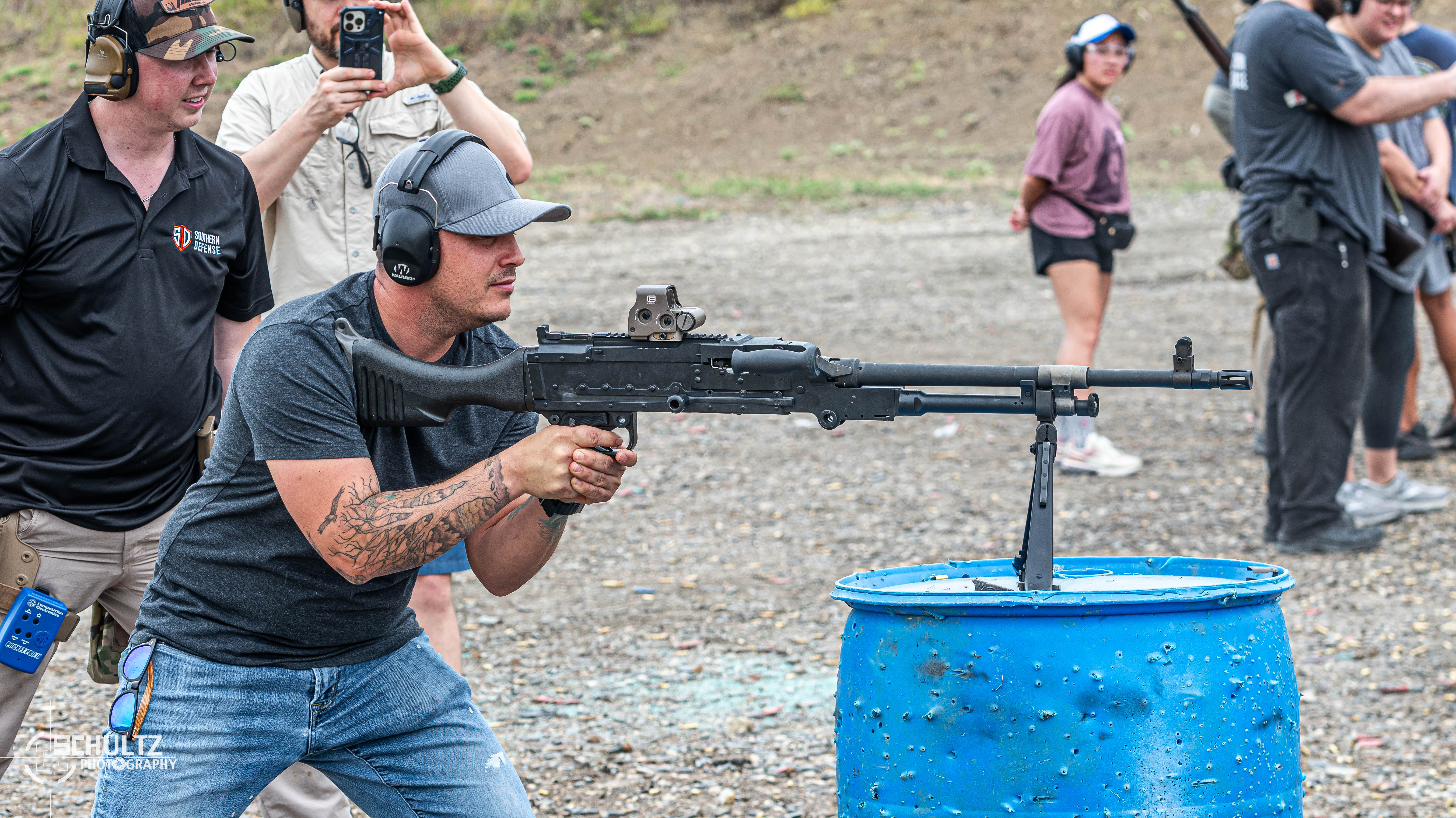 Participant shooting machine gun